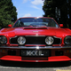 Illustration for article titled A Dirk Diggler Coat For a Red V8 Aston